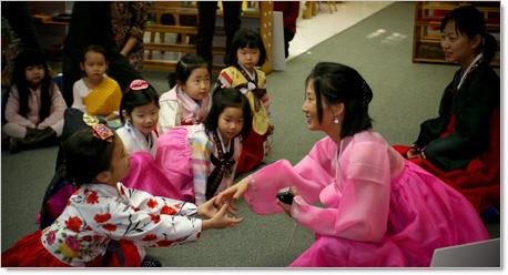 korean mom sharing storytime during prek montessori