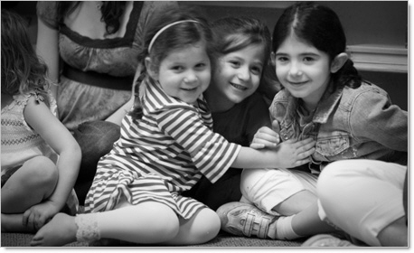 3 preschool girls smiling during after school program