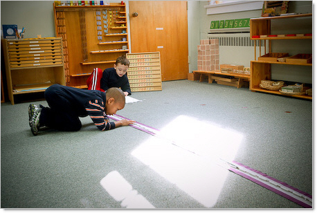 two boys playing with montessori toys